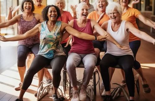A group of mature women wearing activewear, smiling with arms wide.