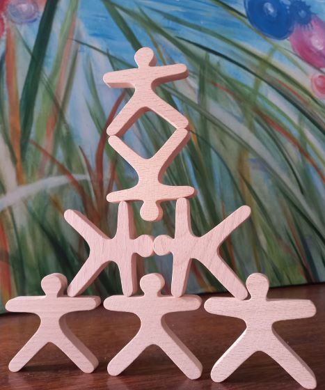 wooden shapes carefully balanced in a pyramid