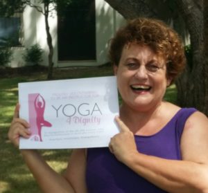woman holds certificate showing her participation as a volunteer for a fundraising event for homeless women