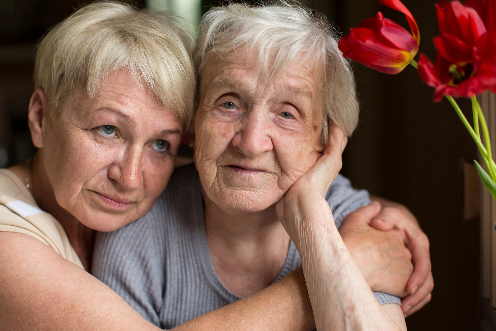 Stock image. Illustrative only, Mature woman hugging her old mother.