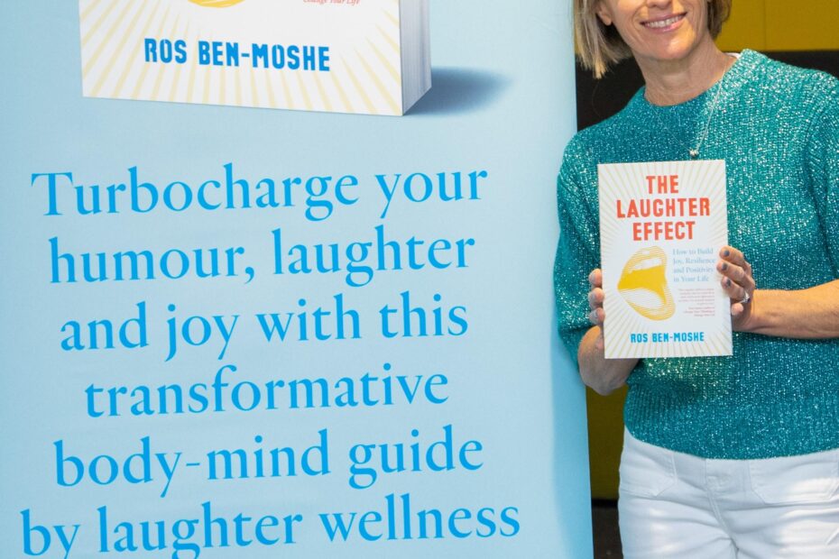 Author Ros Ben-Moshe holds her new book called The Laughter Effect: How to Build Joy, Resilience and Positivity in Your Life