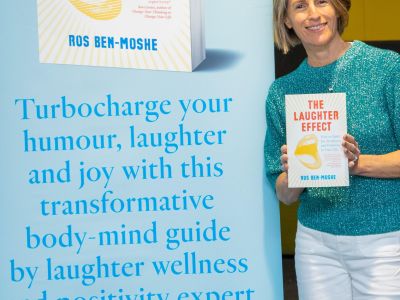 Author Ros Ben-Moshe holds her new book called The Laughter Effect: How to Build Joy, Resilience and Positivity in Your Life