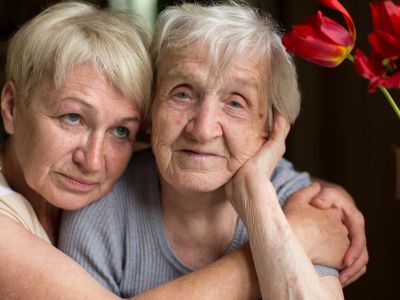Stock image. Illustrative only, Mature woman hugging her old mother.