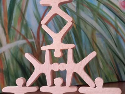 wooden shapes carefully balanced in a pyramid