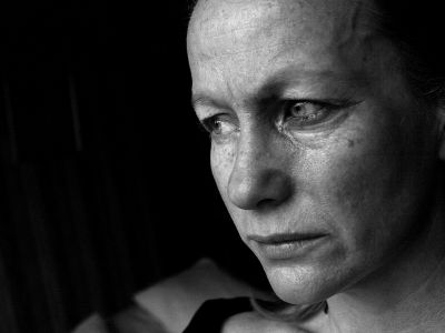 black and white image of a sad woman, conceptual domestic violence, mental health, depression
